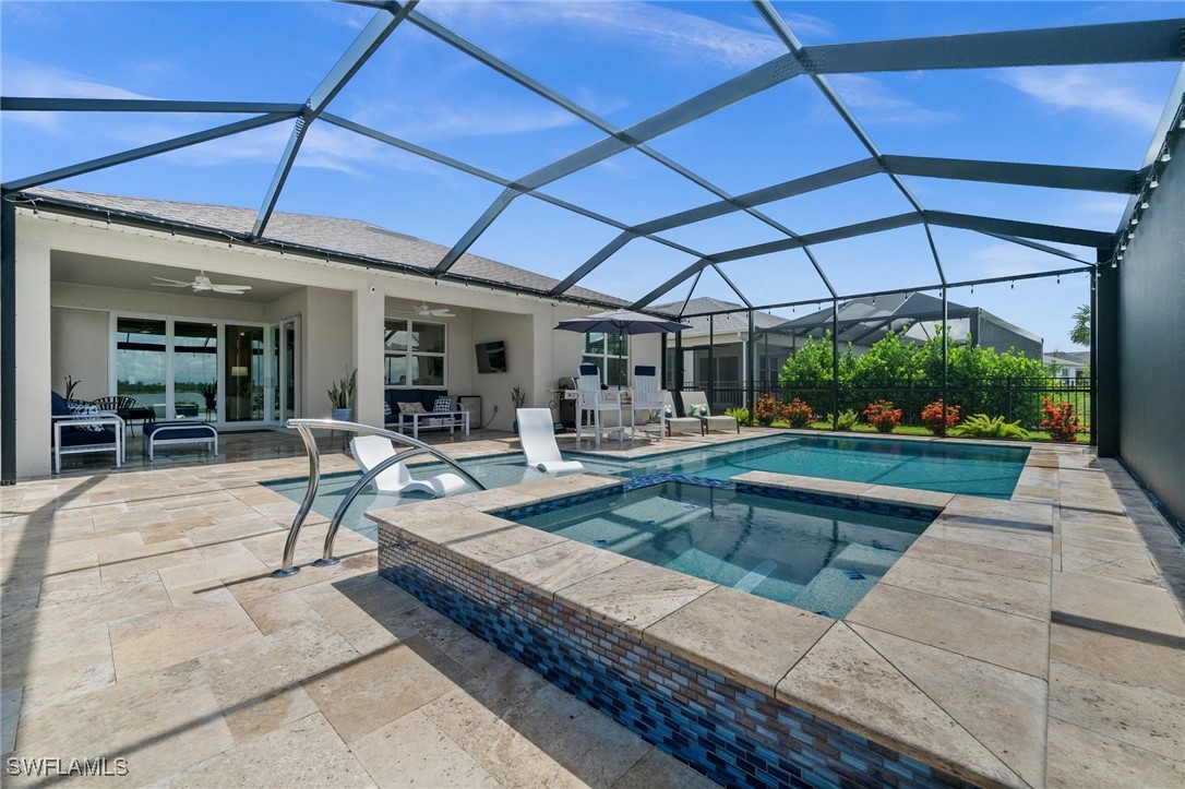 42243 Edgewater Drive Punta Gorda, FL 33982 - Photo 46 of 46 a view of a patio with a table and chairs under an umbrella