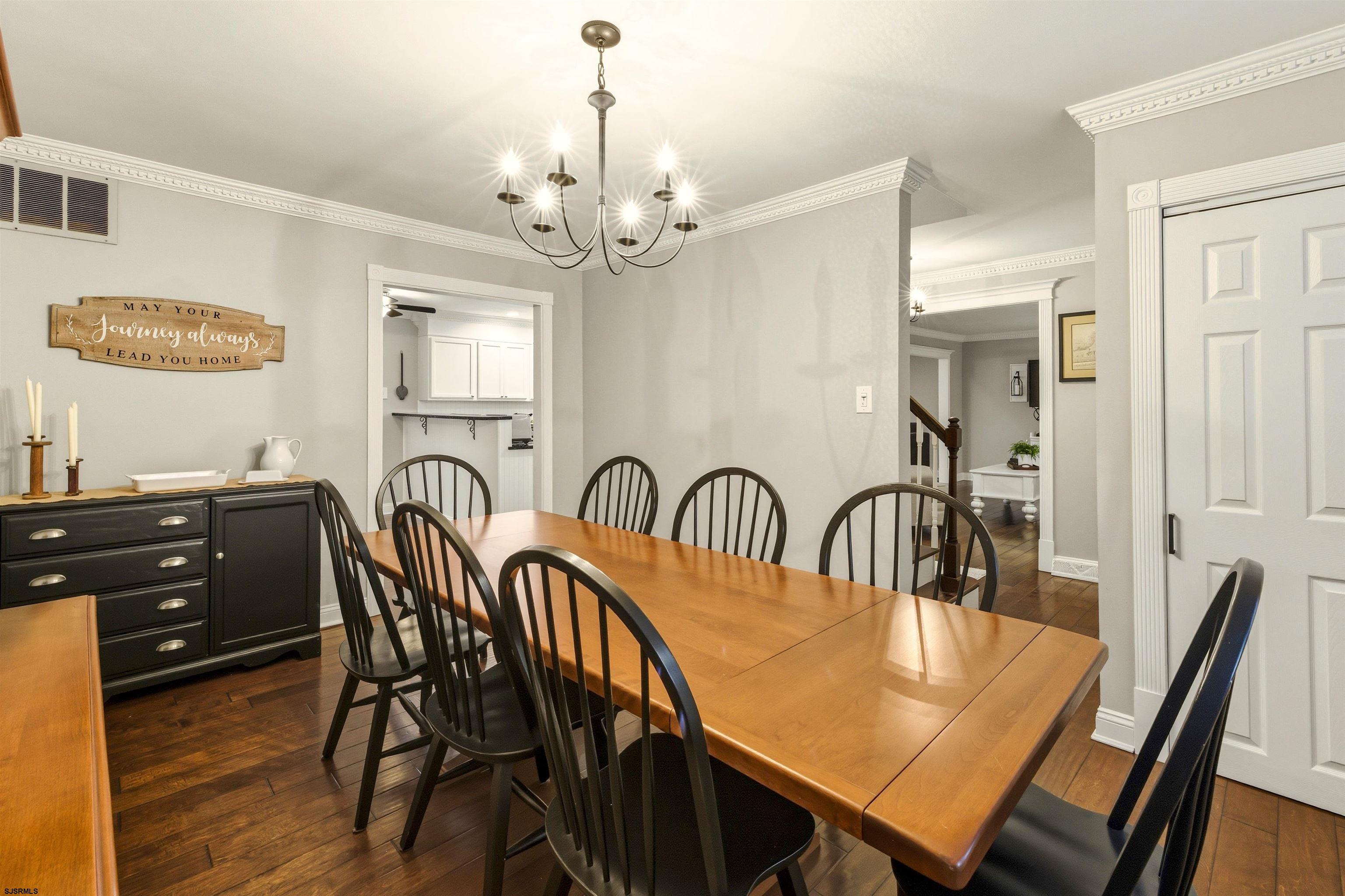1100 Spring Lane Absecon, NJ 08201 - Photo 15 of 25 a view of a dining room with furniture and wooden floor