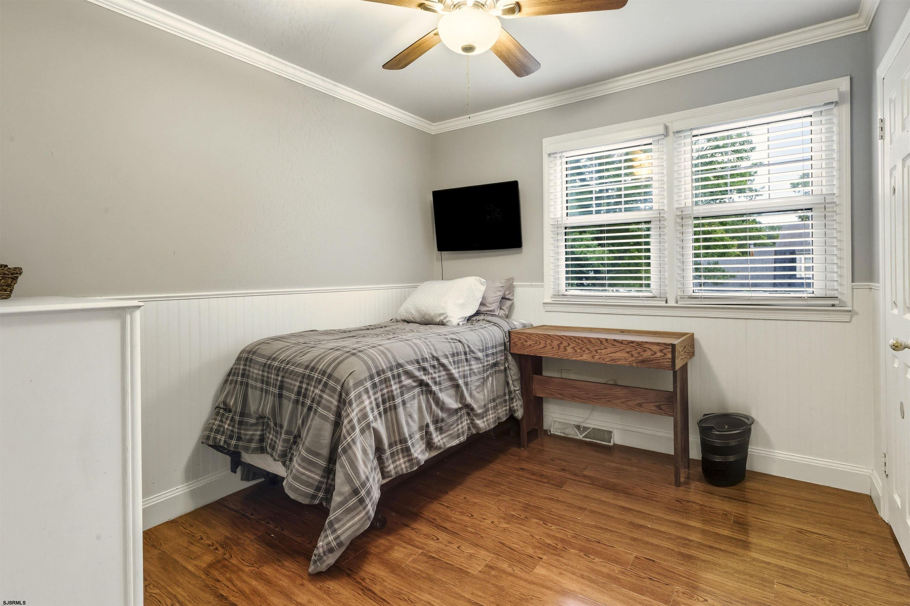 1100 Spring Lane Absecon, NJ 08201 - Photo 16 of 25 a bedroom with a bed and a television