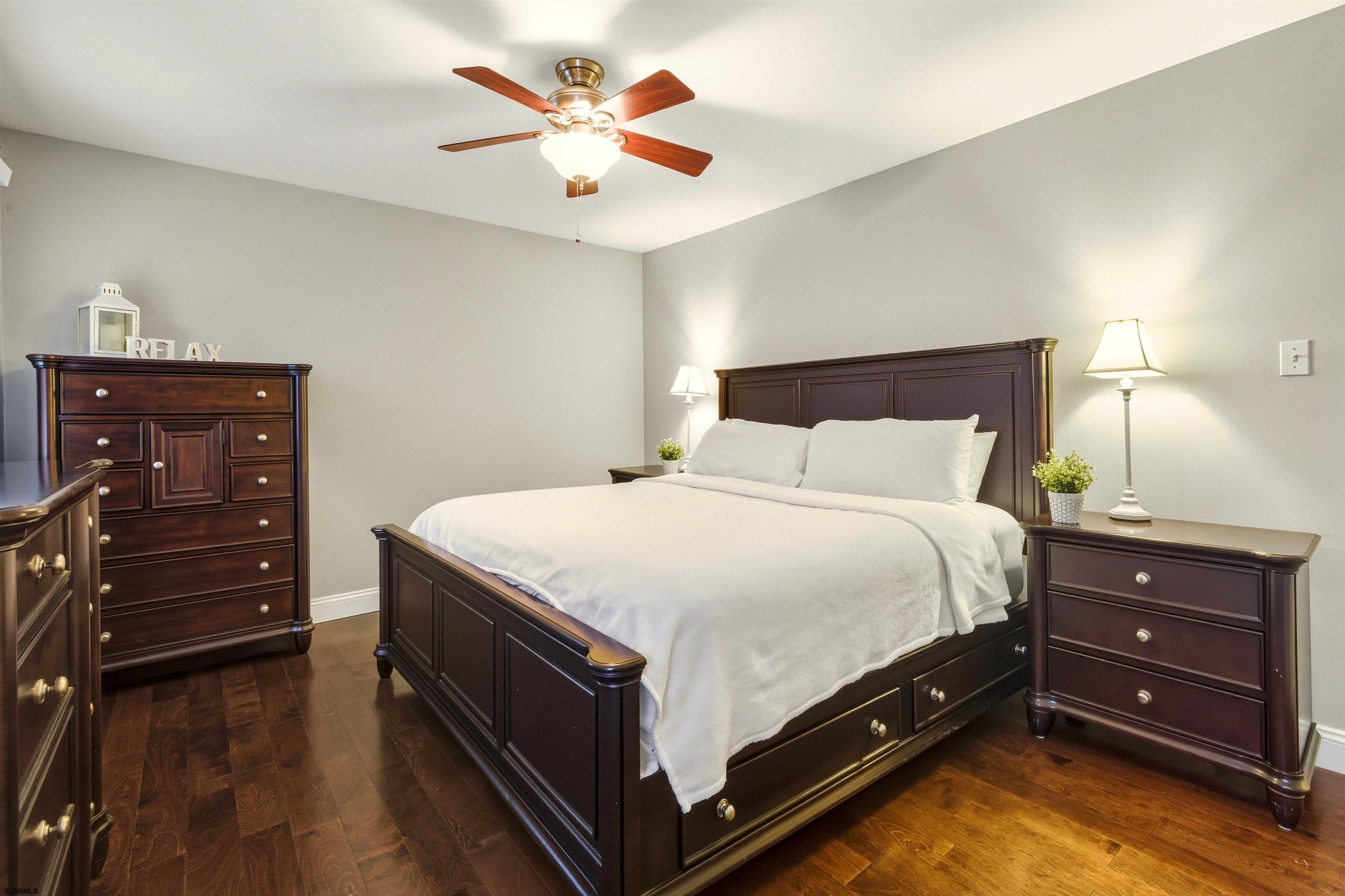 1100 Spring Lane Absecon, NJ 08201 - Photo 18 of 25 a bed room with a bed and a dresser