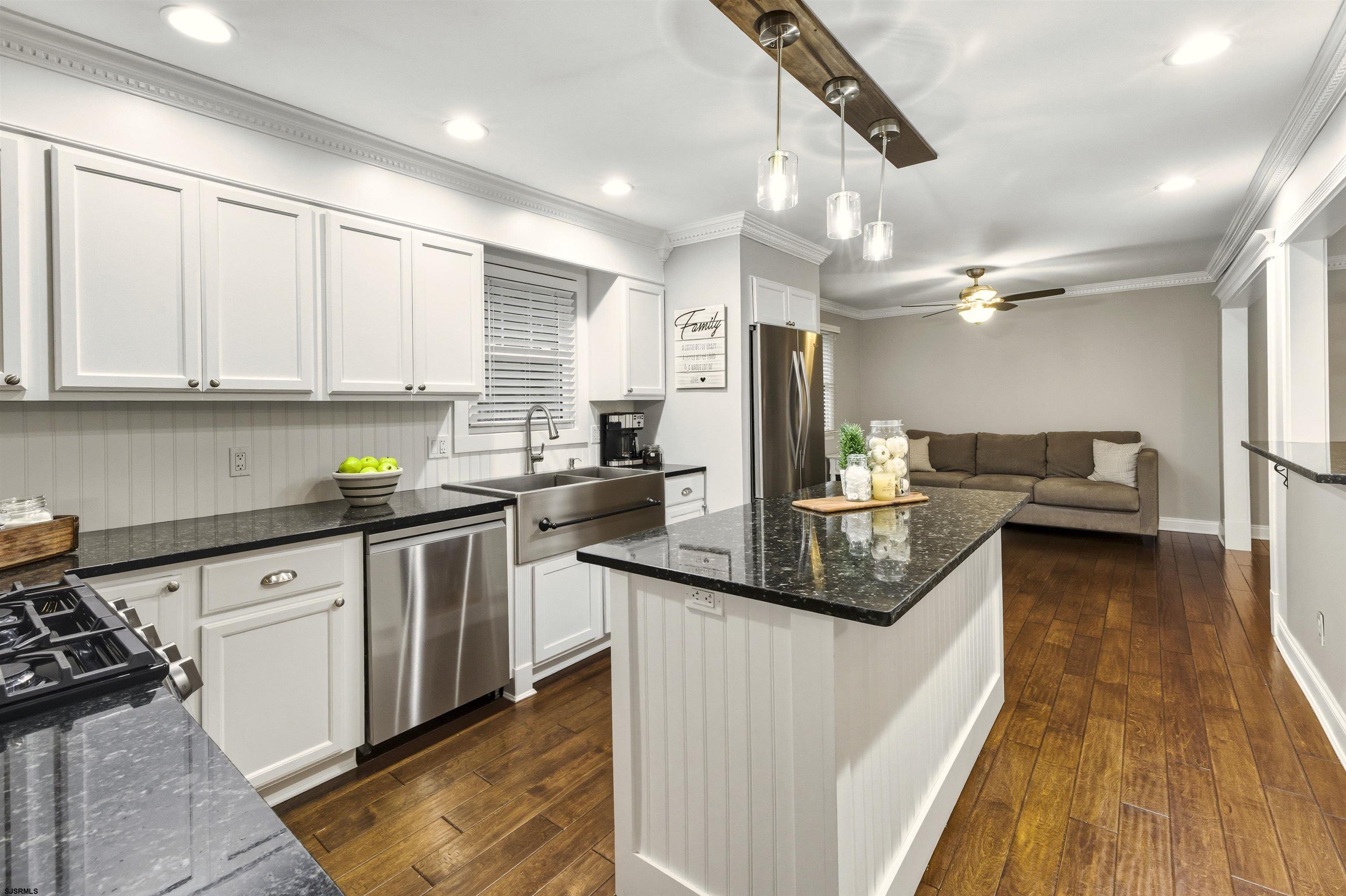 1100 Spring Lane Absecon, NJ 08201 - Photo 2 of 25 a kitchen with granite countertop a sink a counter top space appliances and cabinets
