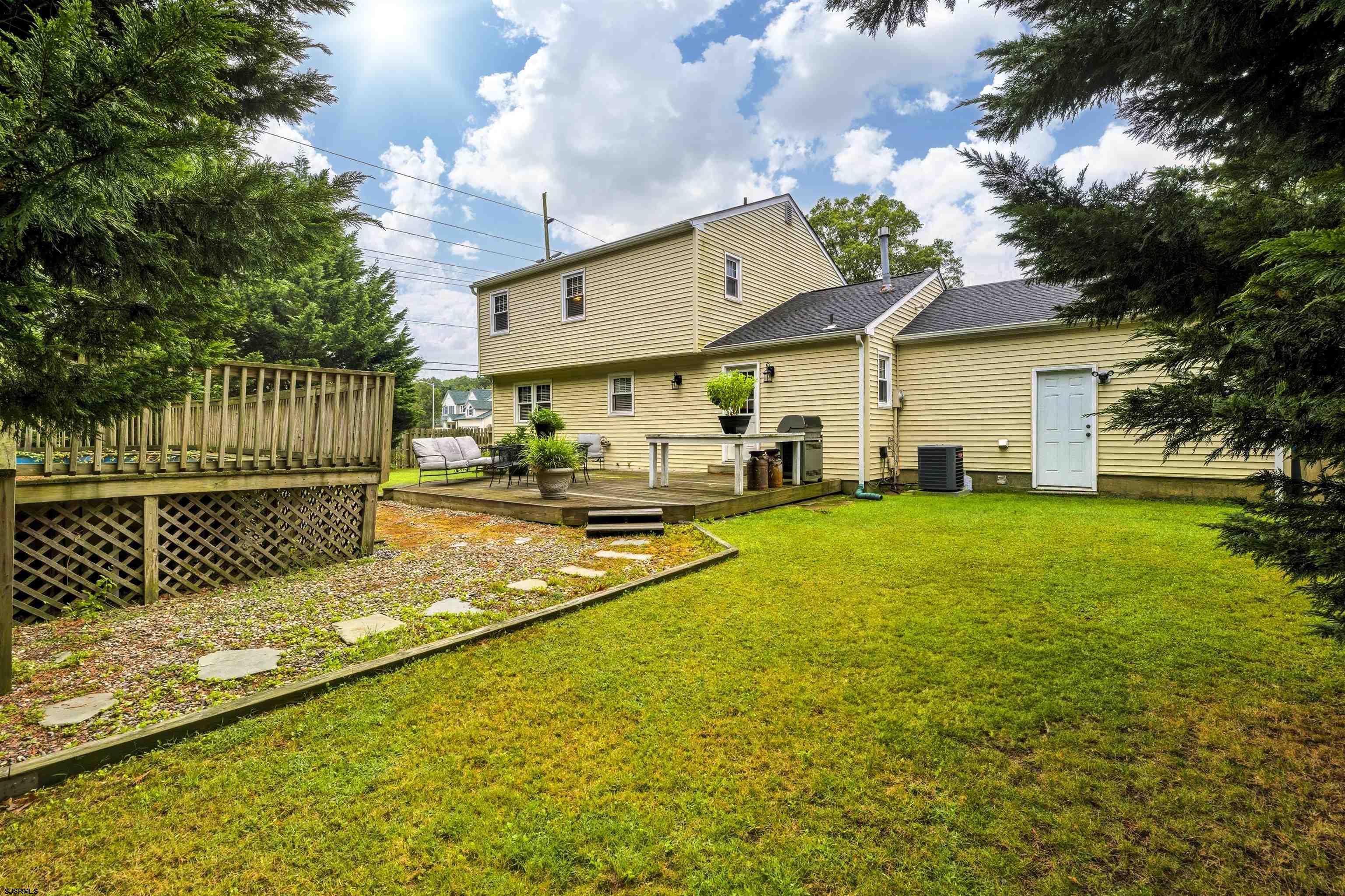 1100 Spring Lane Absecon, NJ 08201 - Photo 24 of 25 a view of a house with a swimming pool