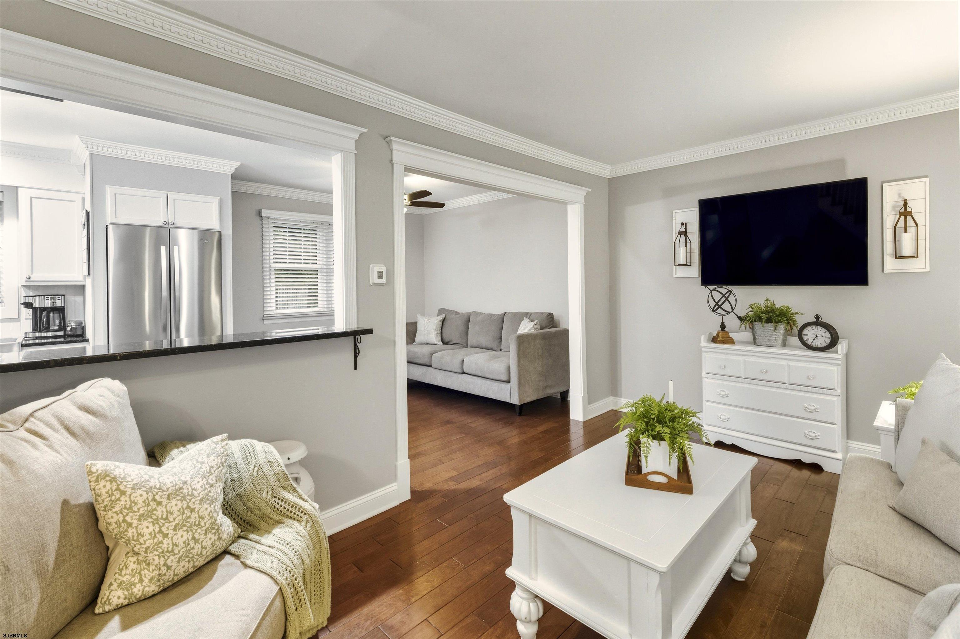 1100 Spring Lane Absecon, NJ 08201 - Photo 8 of 25 a living room with furniture and a flat screen tv