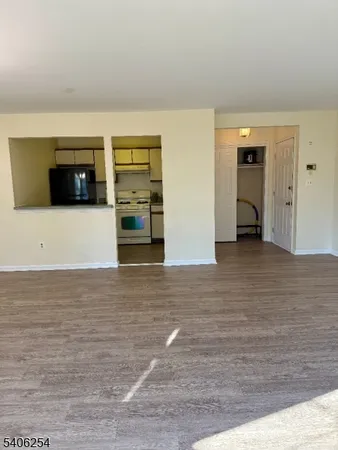 a view of a livingroom with an empty space and a flat screen tv