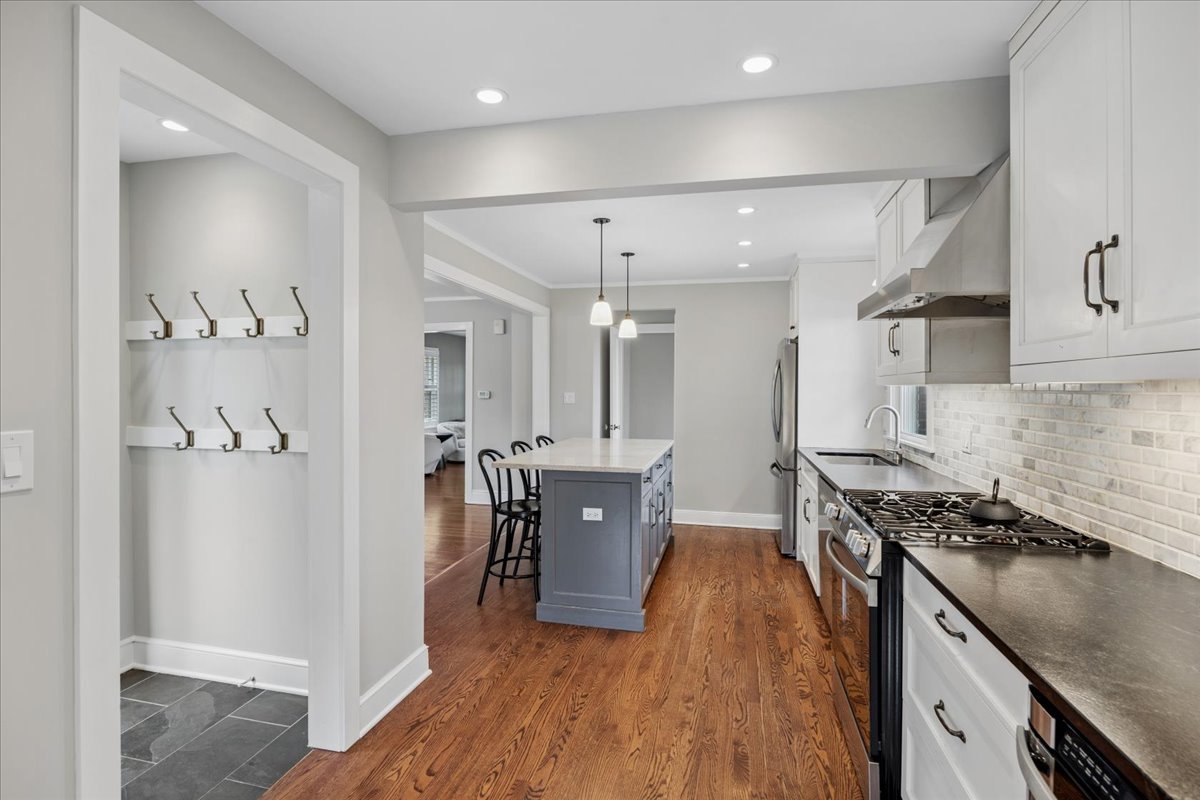 347 Keystone Avenue River Forest, IL 60305 - Photo 11 of 36 a kitchen with a refrigerator a sink and wooden floor