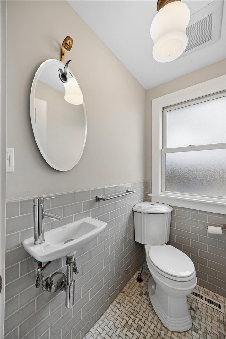 347 Keystone Avenue River Forest, IL 60305 - Photo 17 of 36 a bathroom with a toilet a sink and mirror