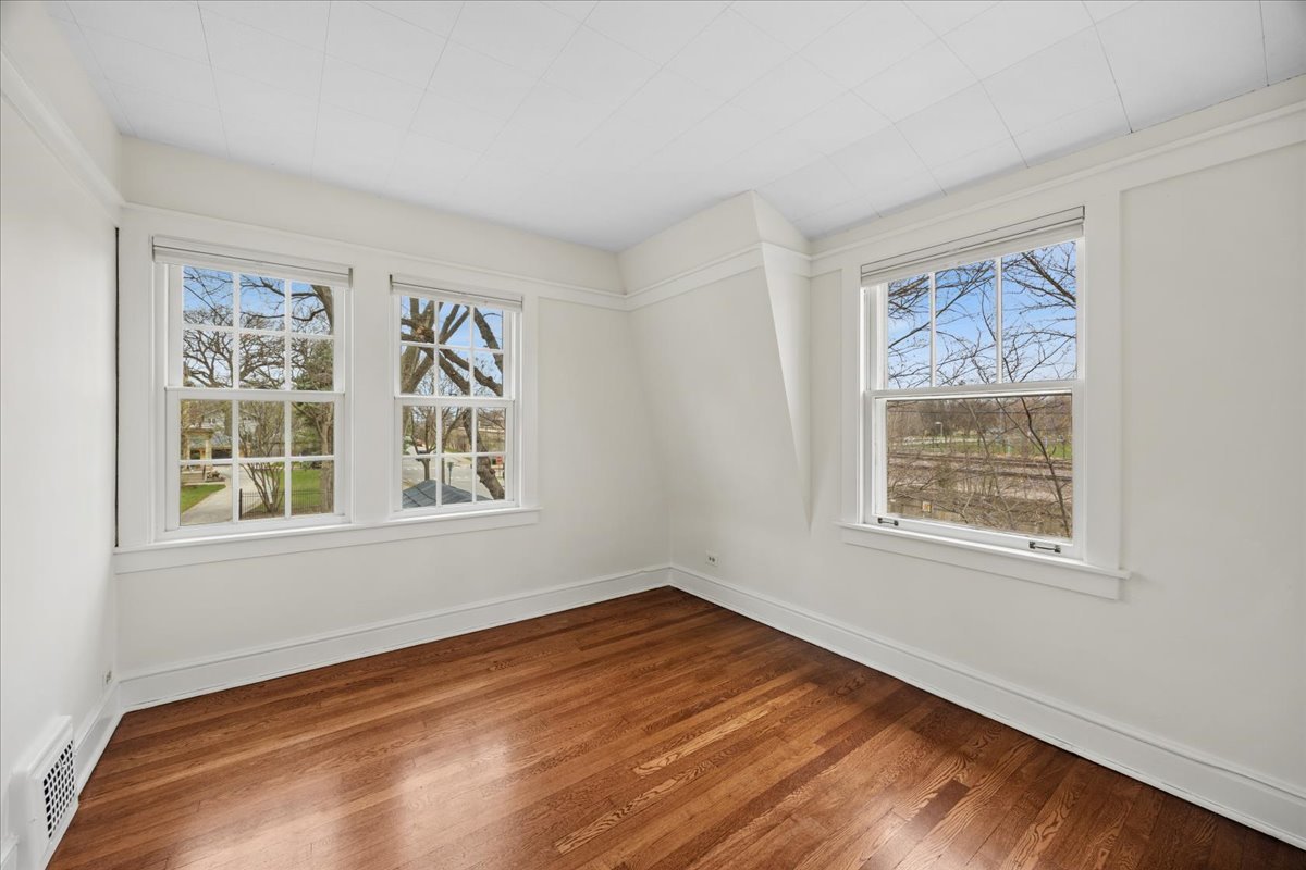 347 Keystone Avenue River Forest, IL 60305 - Photo 21 of 36 a view of an empty room with wooden floor and a window