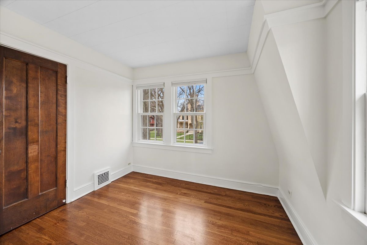 347 Keystone Avenue River Forest, IL 60305 - Photo 22 of 36 an empty room with wooden floor and windows