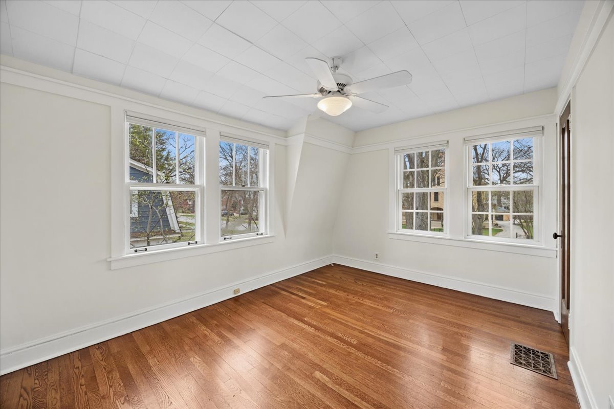 347 Keystone Avenue River Forest, IL 60305 - Photo 23 of 36 a view of an empty room with a window and wooden floor