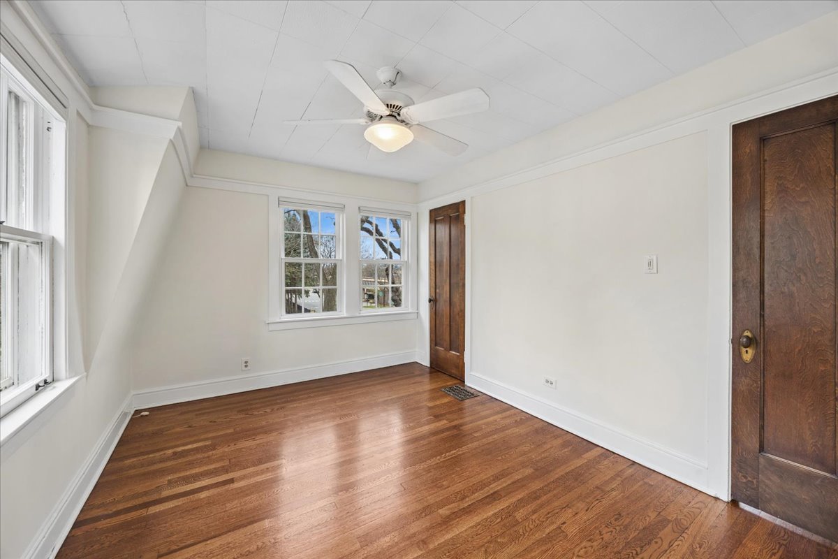 347 Keystone Avenue River Forest, IL 60305 - Photo 24 of 36 a view of an empty room with wooden floor and a window