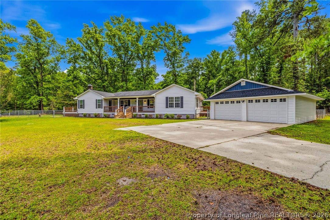 3524 Pine Log Road Lumberton, NC 28360 - Photo 2 of 42 a front view of a house with garden
