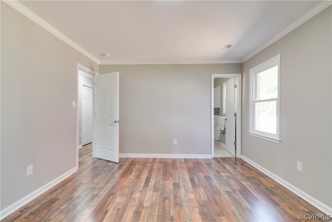 10201 Ridgerun Road Chesterfield, VA 23832 - Photo 21 of 37 wooden floor in an empty room with a window