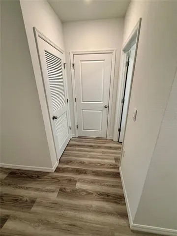 a view of a hallway view with staircase