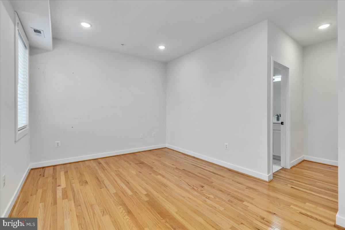 1416 22nd Street Southeast, Unit 9 Washington, DC 20020 - Photo 18 of 31 a view of empty room with wooden floor