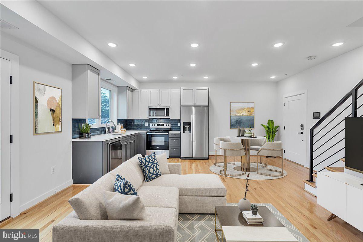 1416 22nd Street Southeast, Unit 9 Washington, DC 20020 - Photo 2 of 31 a living room with furniture kitchen and a table