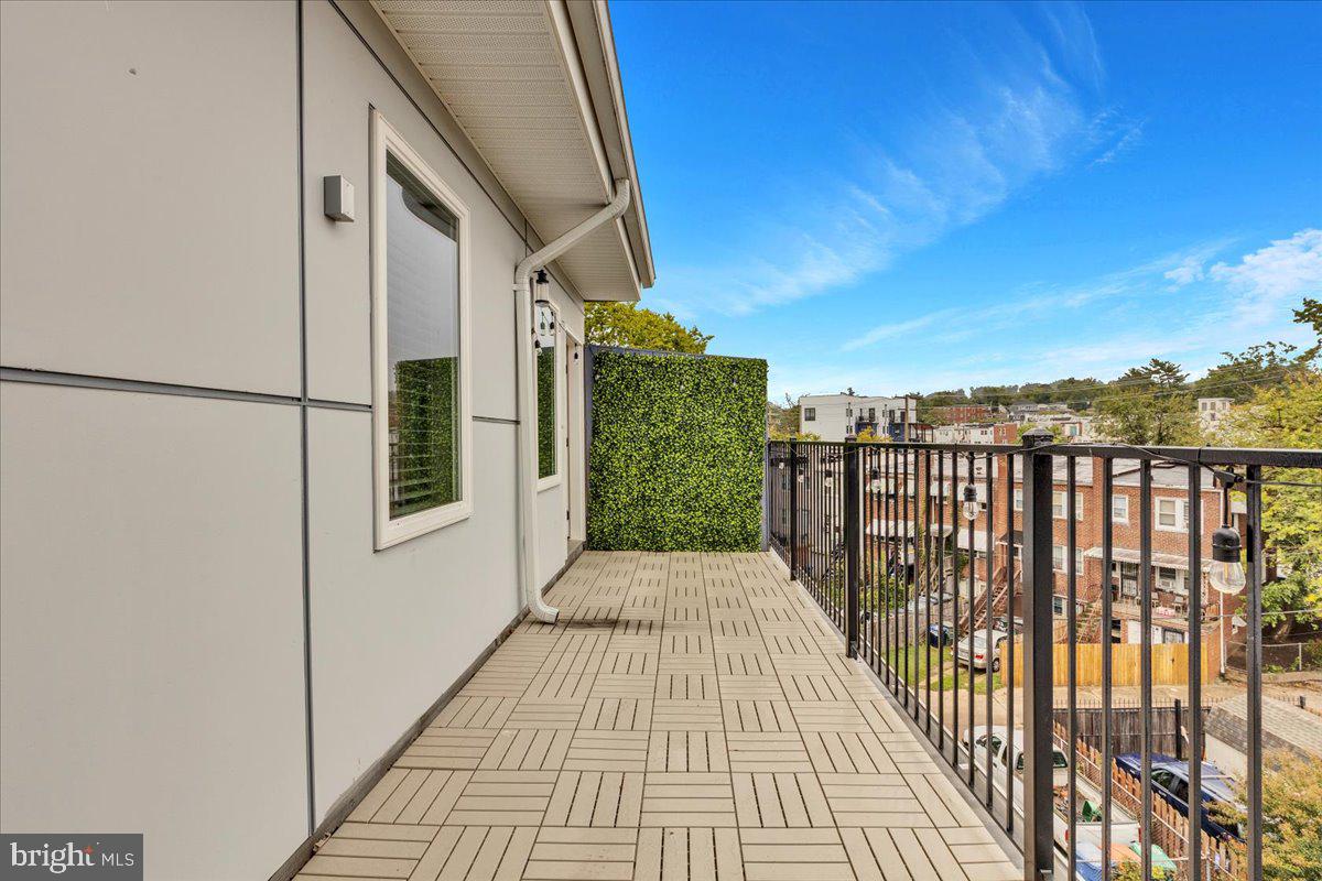 1416 22nd Street Southeast, Unit 9 Washington, DC 20020 - Photo 25 of 31 a view of a balcony with wooden floor