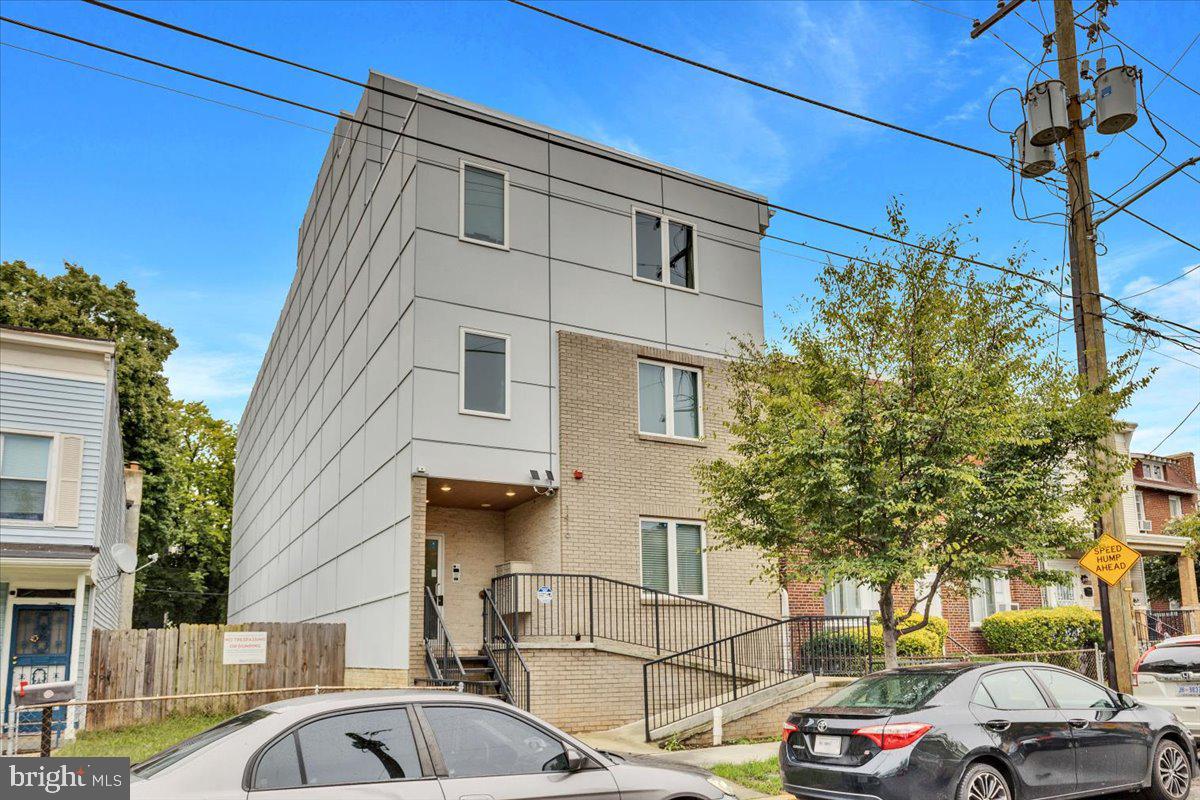 1416 22nd Street Southeast, Unit 9 Washington, DC 20020 - Photo 28 of 31 a couple of cars parked in front of a house