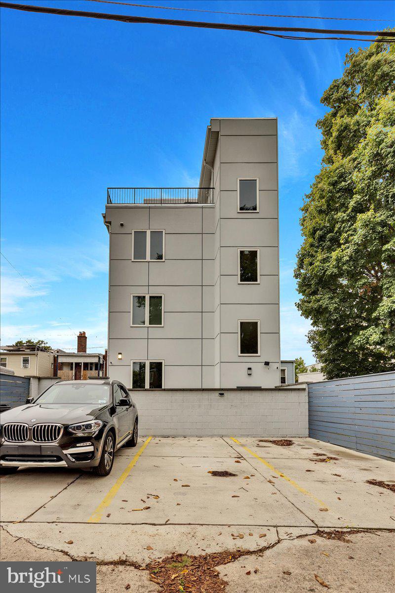 1416 22nd Street Southeast, Unit 9 Washington, DC 20020 - Photo 30 of 31 a view of a car parked in front of a house