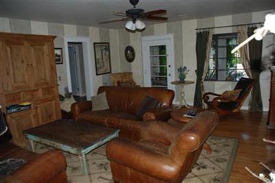 804 South Rice Road Ojai, CA 93023 - Photo 4 of 10 a living room with furniture a flat screen tv and a window