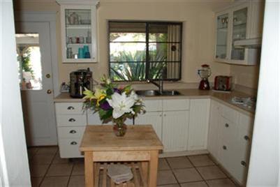 804 South Rice Road Ojai, CA 93023 - Photo 5 of 10 a view of a sink and dishwasher with wooden floor