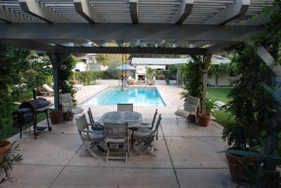 804 South Rice Road Ojai, CA 93023 - Photo 7 of 10 a view of a patio with table and chairs and potted plants