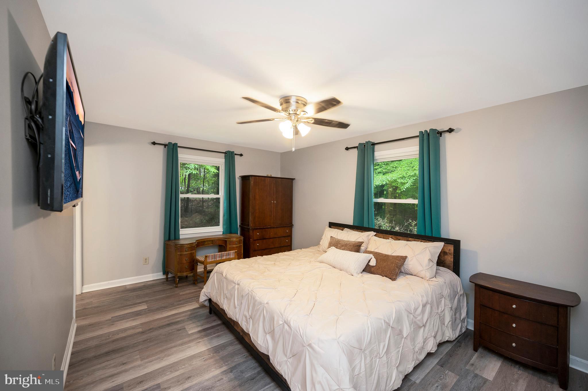 679 Cropp Road Fredericksburg, VA 22406 - Photo 34 of 39 a bedroom with a bed and a large window