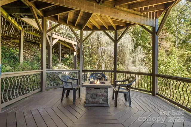 a view of a chairs and table on the deck