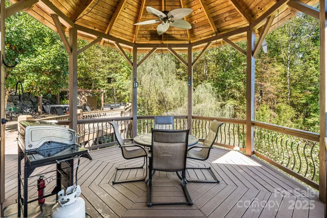 a view of a chairs and table on the deck