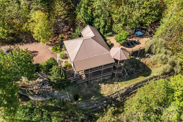 a aerial view of a house with swimming pool and sitting area