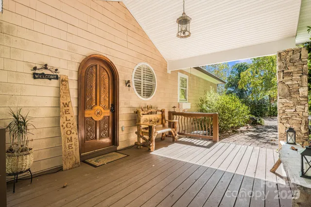 a view of a door and wooden floor