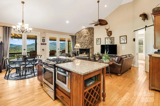 a kitchen with a stove and a wooden floor