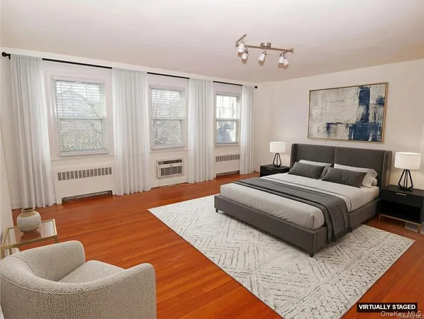 a bedroom with bed and window