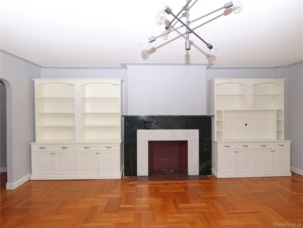 a view of a room with a fireplace and cabinet