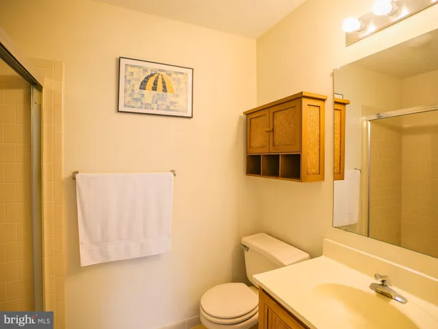 a bathroom with a toilet and a sink