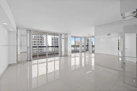 a room with natural light and glass door