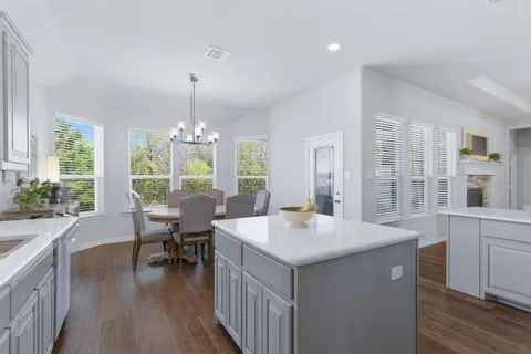a kitchen with a sink stove and refrigerator