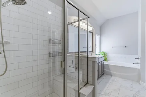 a bathroom with a double vanity sink and a mirror