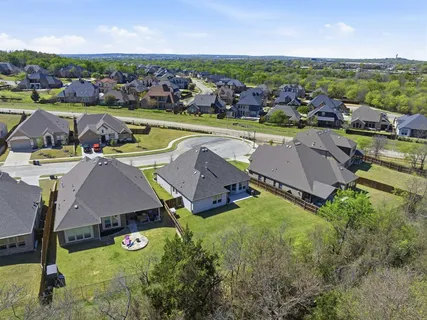 an aerial view of a house with swimming pool