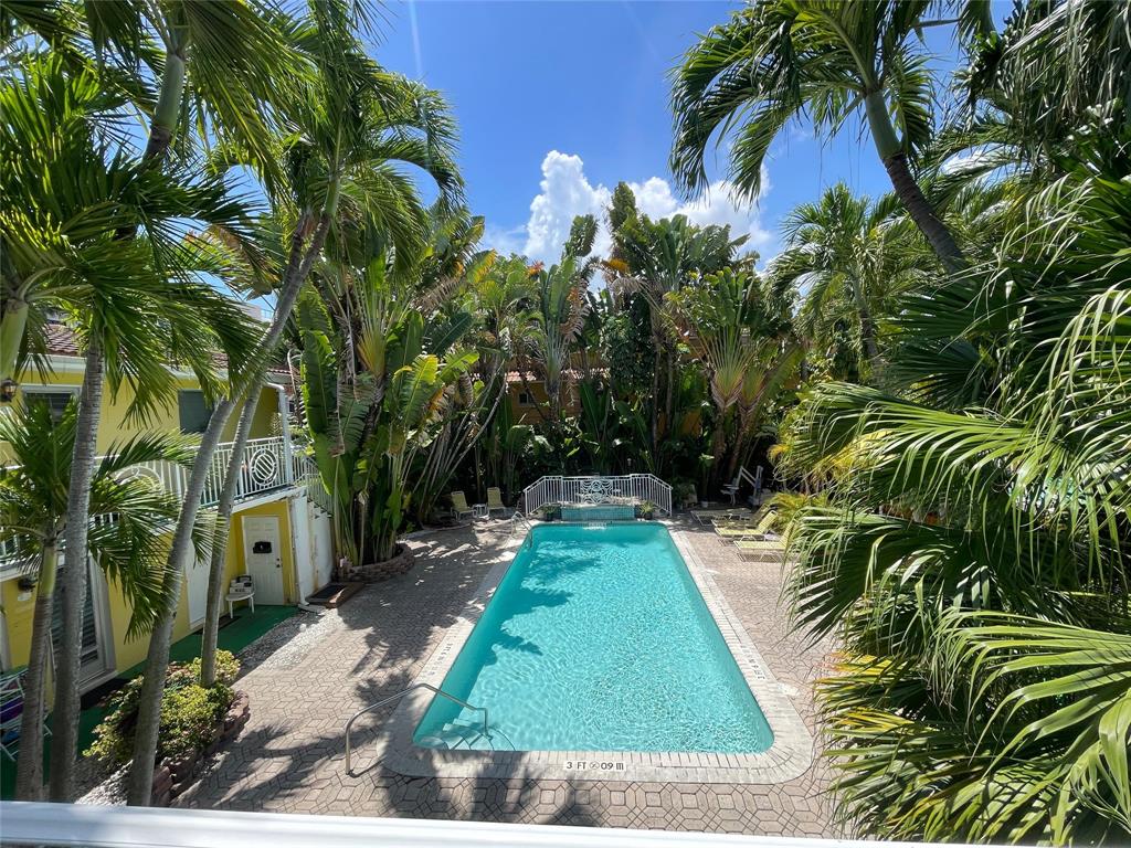 77 Hendricks Isle, Unit 9 Fort Lauderdale, FL 33301 - Photo 1 of 21 a view of a backyard with plants