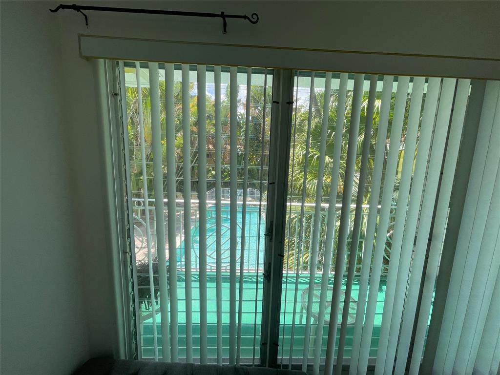 77 Hendricks Isle, Unit 9 Fort Lauderdale, FL 33301 - Photo 20 of 21 a view of a glass door and deck