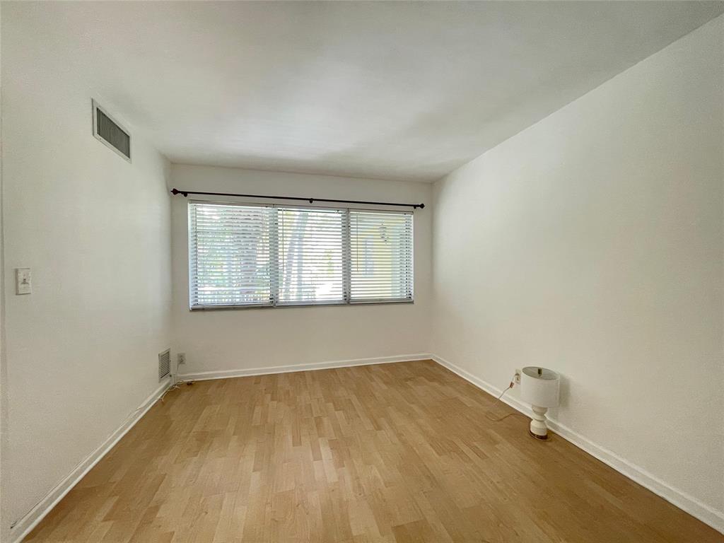 77 Hendricks Isle, Unit 9 Fort Lauderdale, FL 33301 - Photo 4 of 21 an empty room with a window