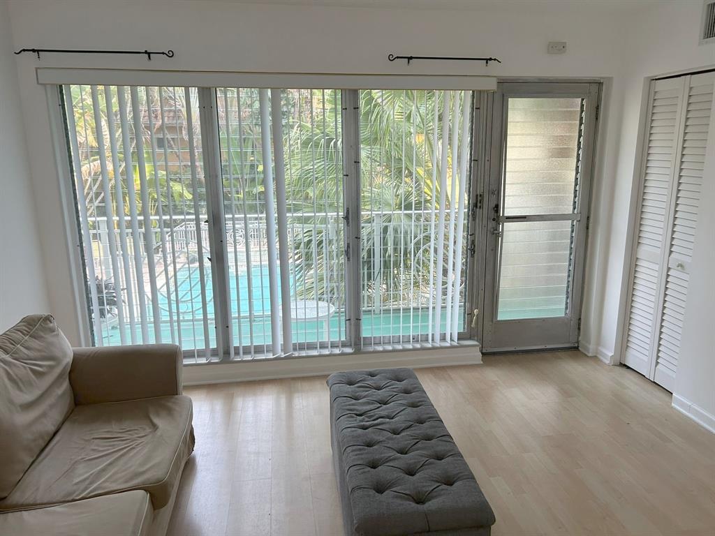 77 Hendricks Isle, Unit 9 Fort Lauderdale, FL 33301 - Photo 5 of 21 a living room with furniture and a large window