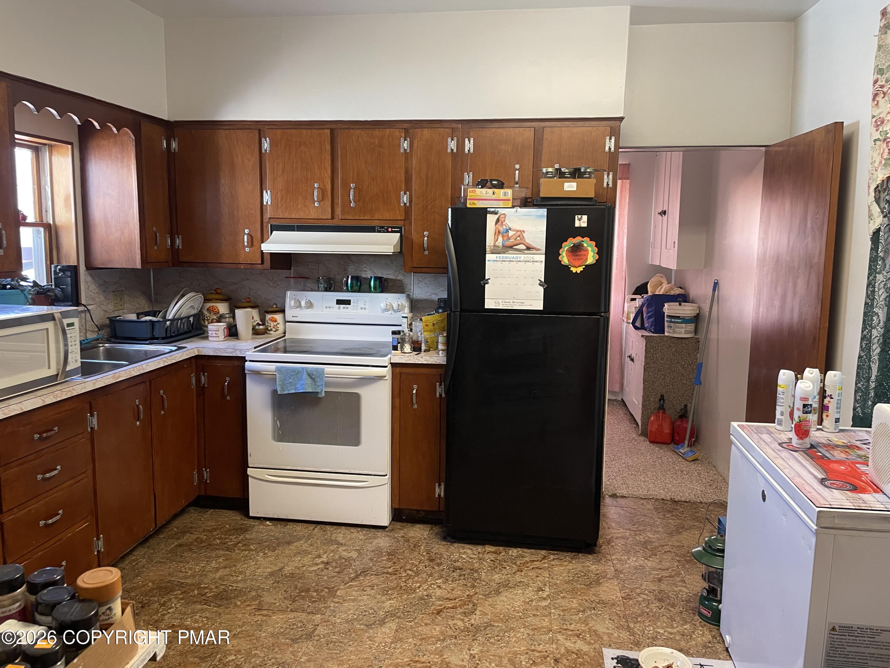 1055 Main Road Lehighton, PA 18235 - Photo 13 of 22 a kitchen with a refrigerator and cabinets