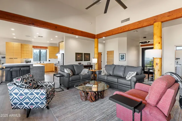 a large kitchen with kitchen island a sink table and chairs