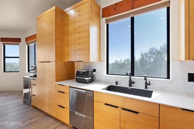 a view of walk in closet with lots of books