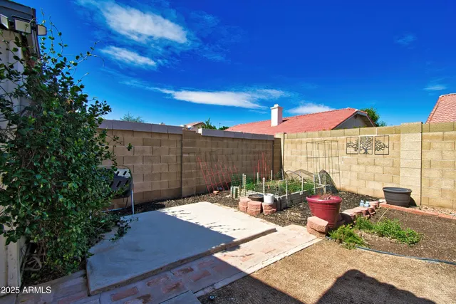 a view of a house with a yard and garage