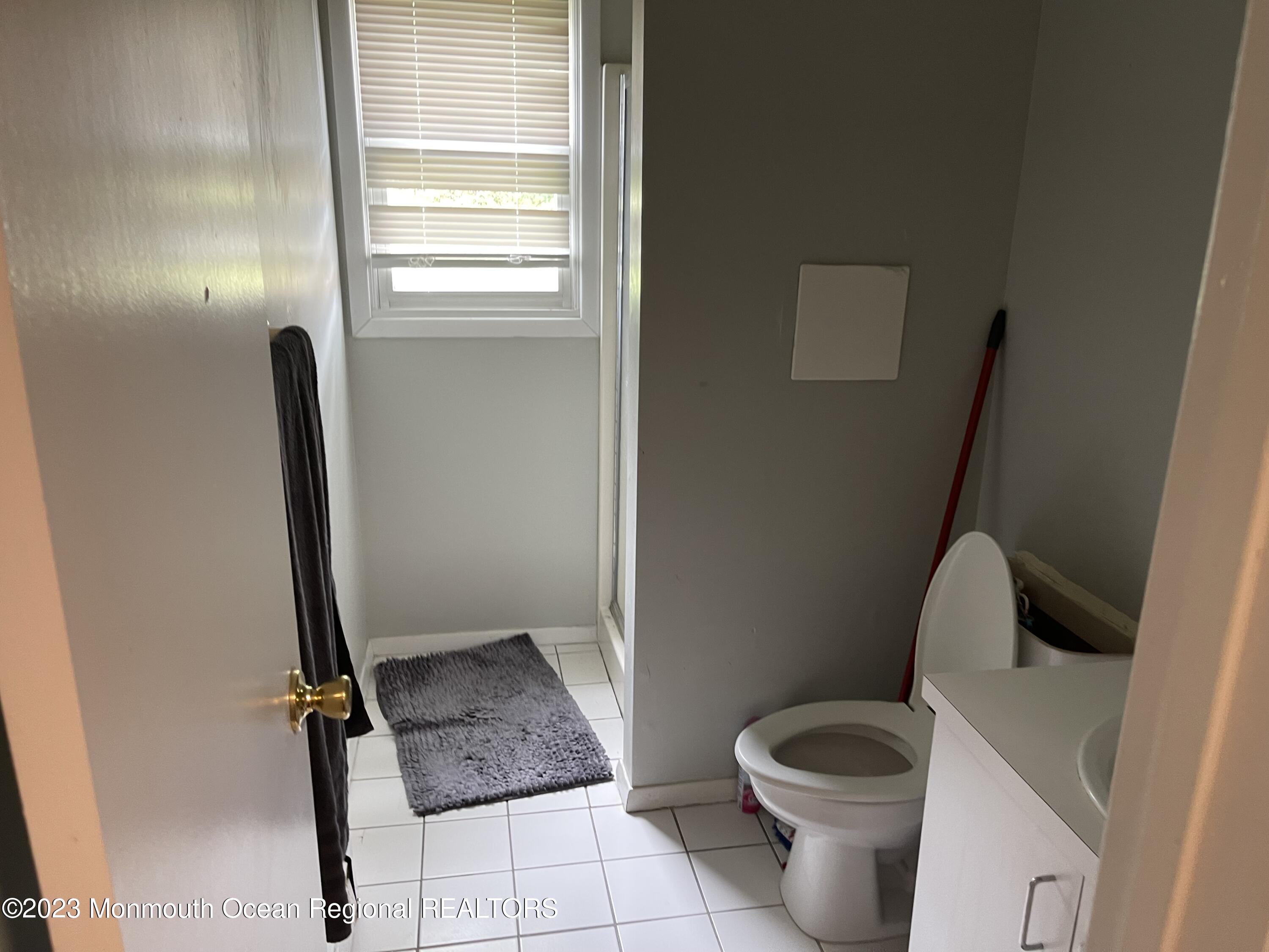 233 Royal Place Elberon, NJ 07740 - Photo 9 of 10 a bathroom with a toilet and a shower