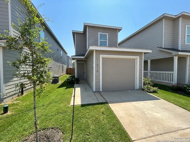 a view of a back yard of the house