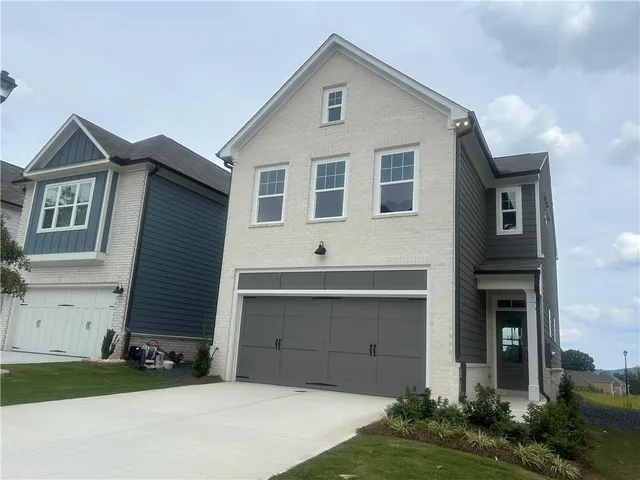a view of house with yard