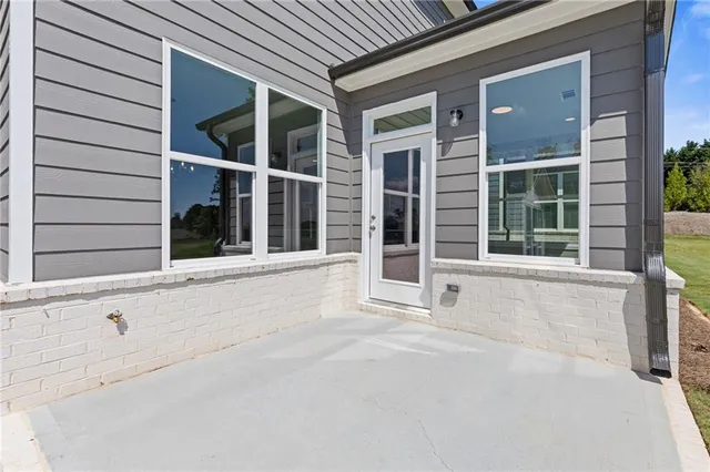 front view of a house with a large window